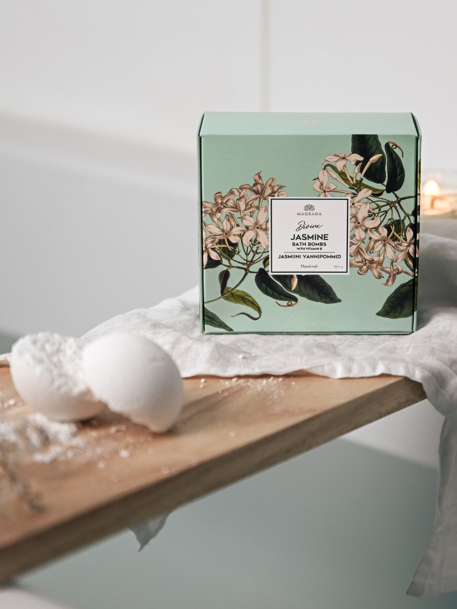Magrada Organic Cosmetics jasmine bath bomb set with floral green packaging and white bath bombs on wooden surface