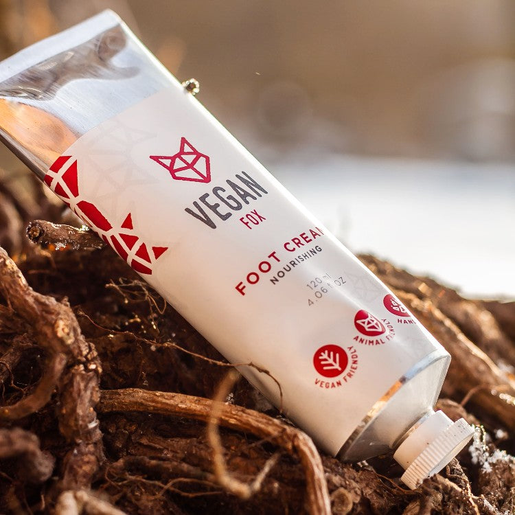 Vegan Fox hydrating foot cream 120ml tube placed on natural wooden surface with focus on branding