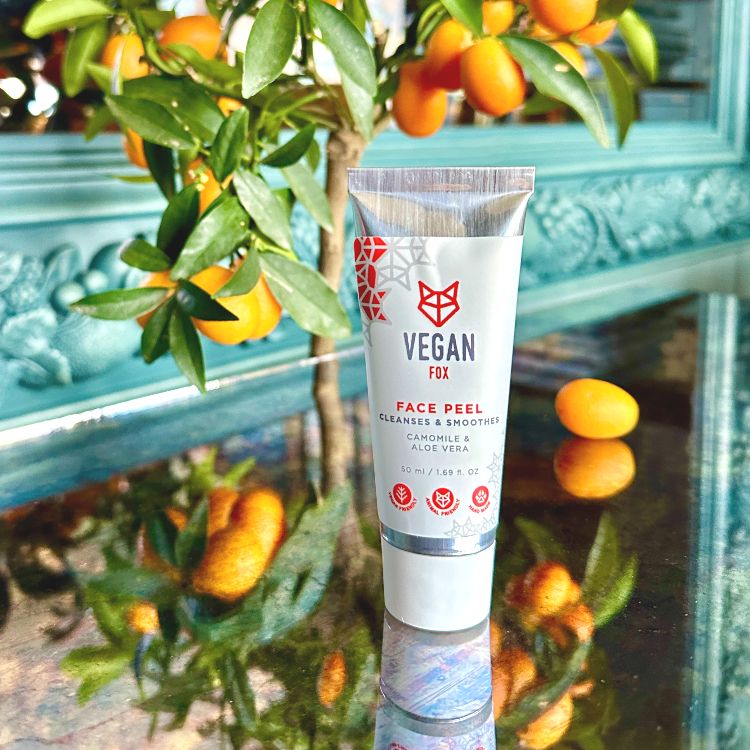 Vegan Fox natural face peel for smoother skin with chamomile and aloe vera in a white tube on reflective surface
