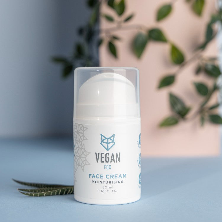 Vegan Fox vegan moisturizing face cream in white pump bottle with natural plant background